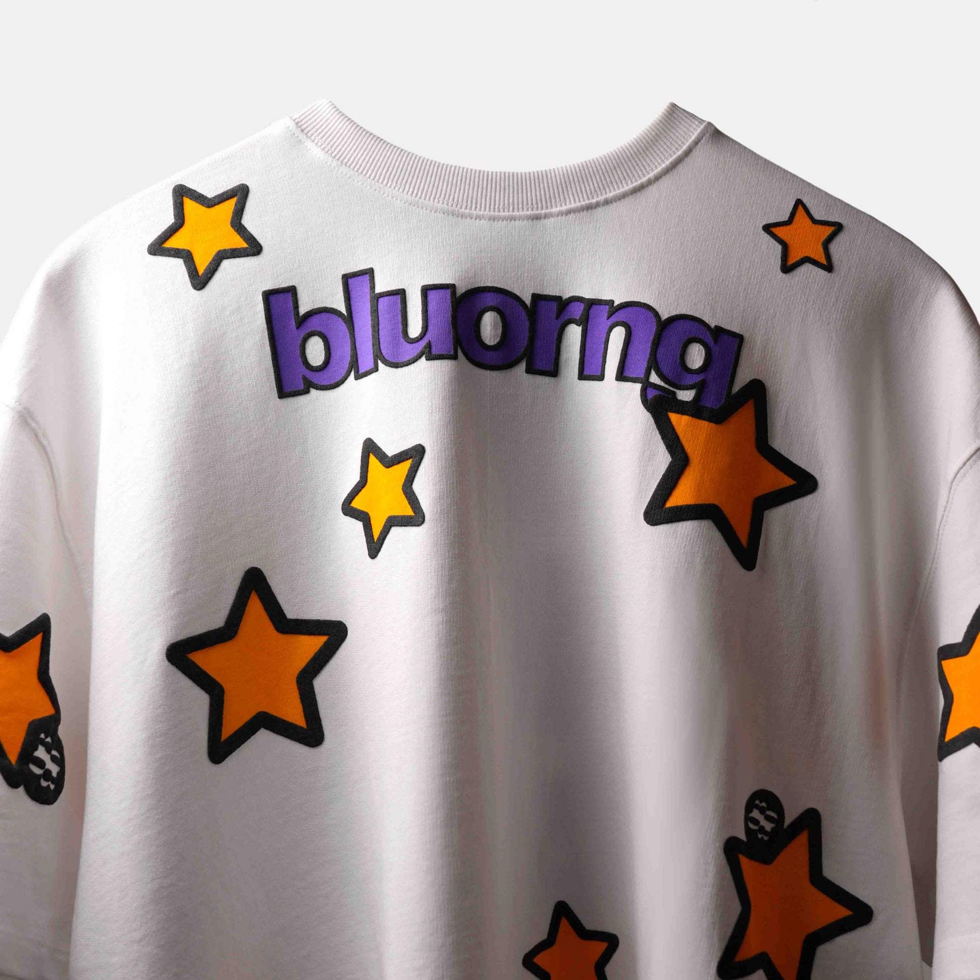 Premium oversized white tee with bold puff stars