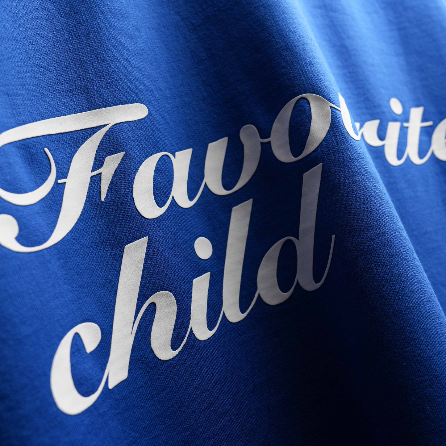 Premium oversized blue tee Favourite Child statement design