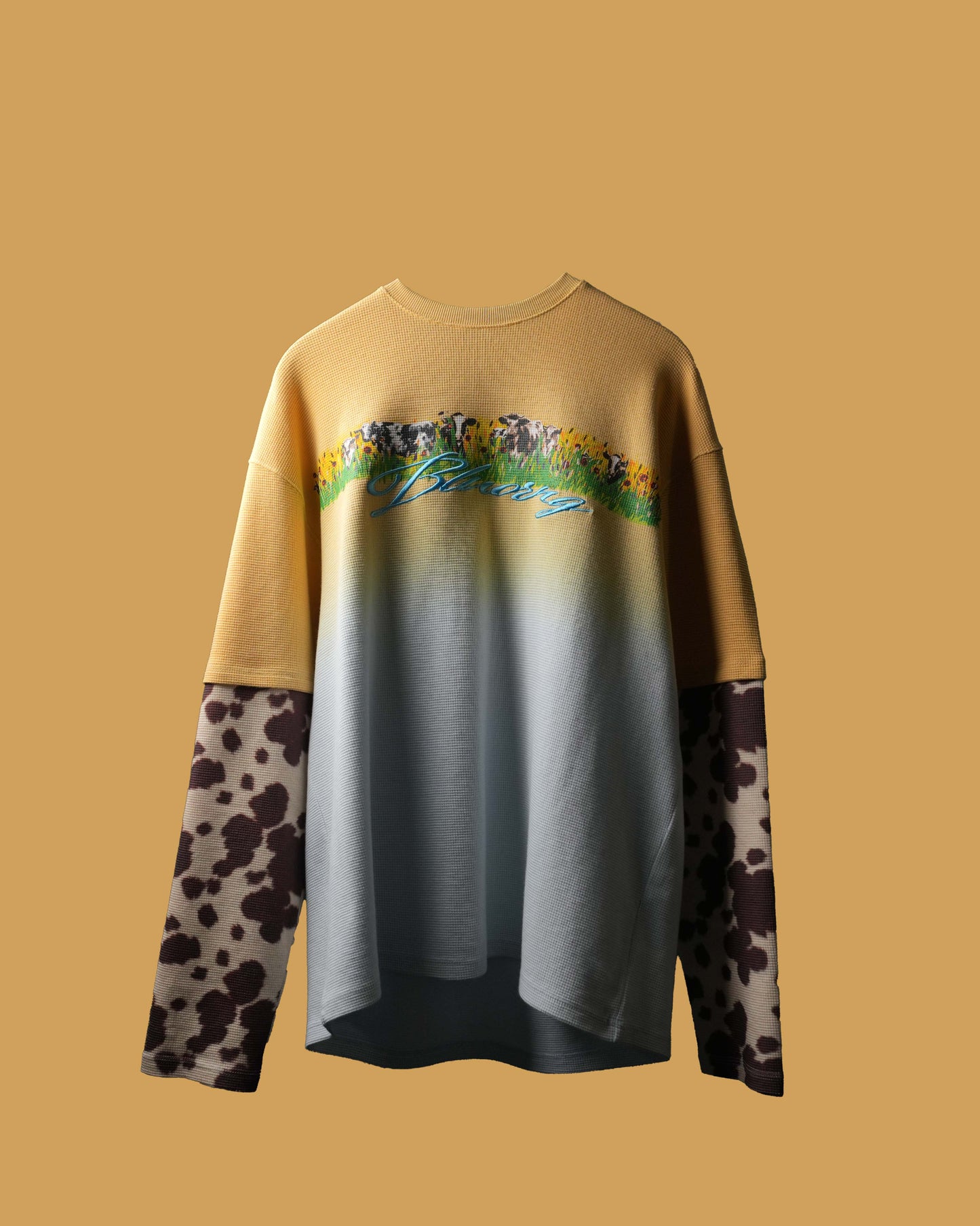 Gradient sweatshirt with floral design and animal print sleeves on a beige background