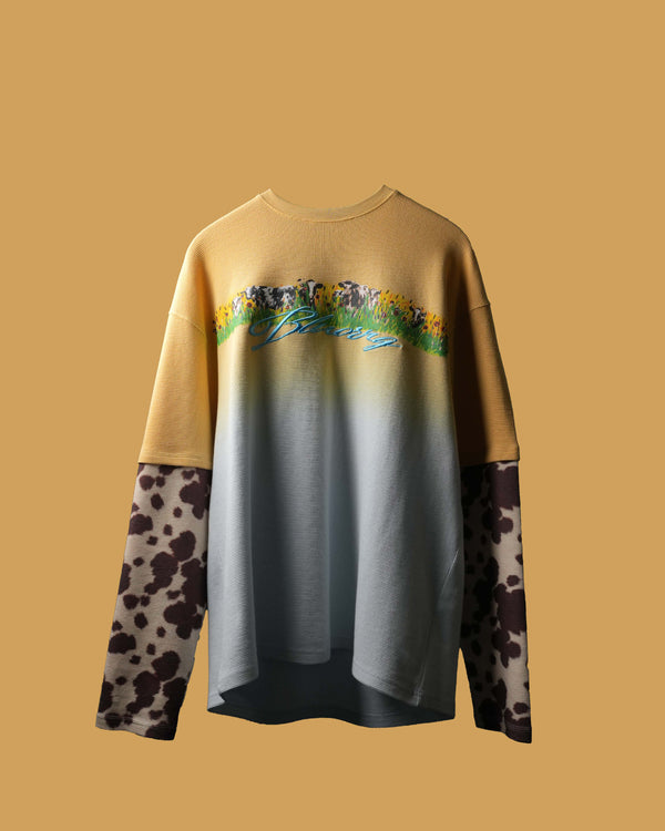 Gradient sweatshirt with floral design and animal print sleeves on a beige background