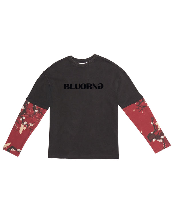 A long-sleeve t-shirt in dark charcoal gray with 'BLUORNG' printed in black across the chest, featuring red floral patterned sleeves.