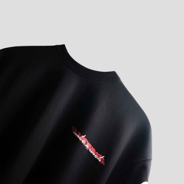 Luxury oversized black tee with puff print message