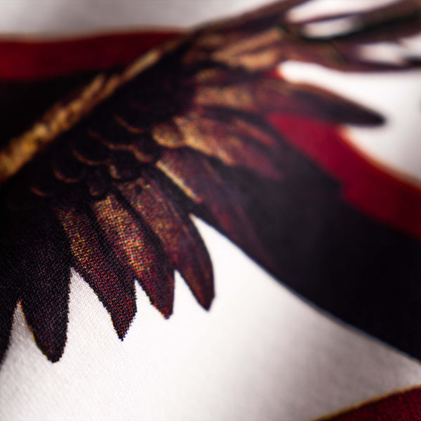 Premium white oversized tee with bold Feather & Fang artwork