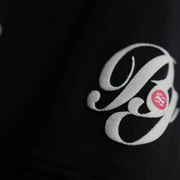 Premium oversized black cotton polo with graphic print