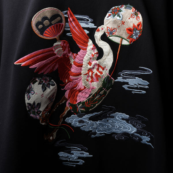Premium black oversized tee crane design embroidery detail