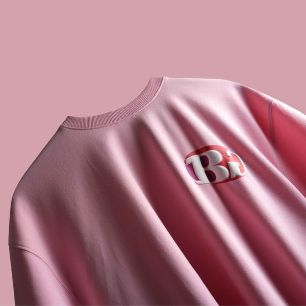 Pink oversized graphic t-shirt with bold puff text