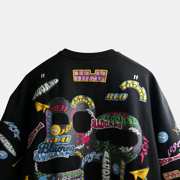 Premium oversized black t-shirt with all-over sticker slap graphic