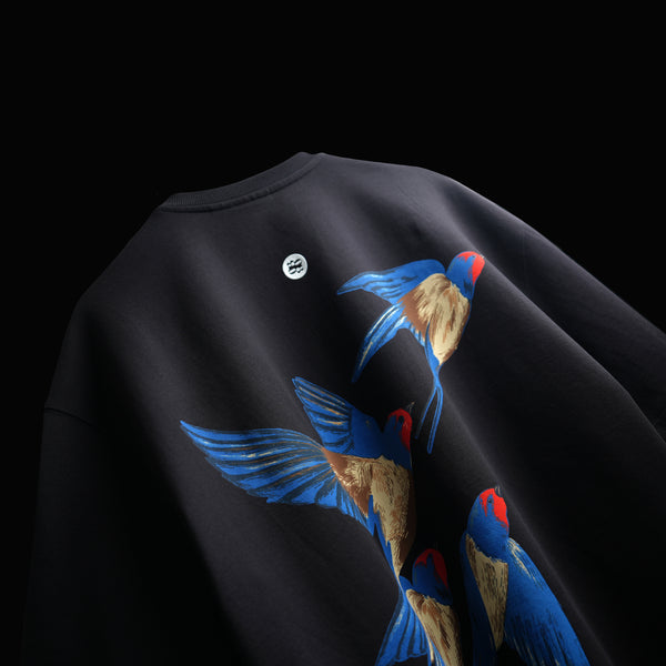 Black cotton t-shirt with bold bird graphic and high-density print