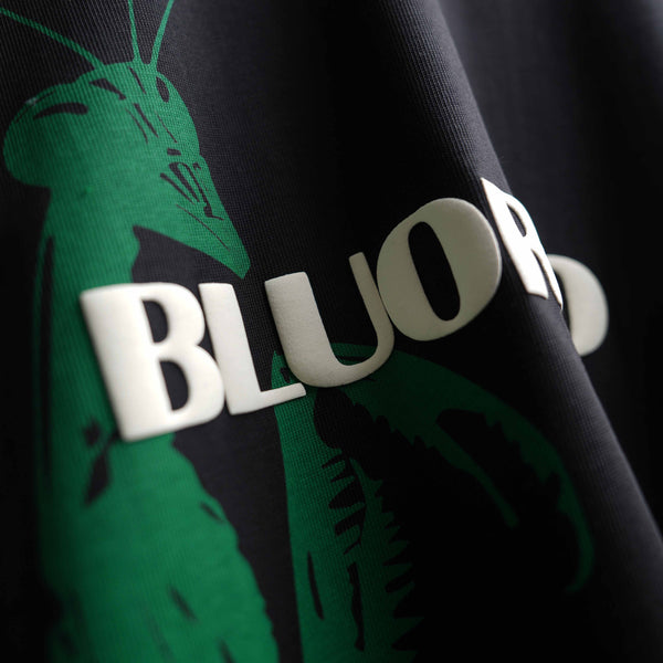 Premium black oversized screen print tee with praying mantis design