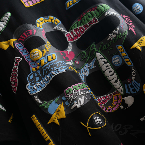 Black oversized premium tee featuring bold sticker slap design