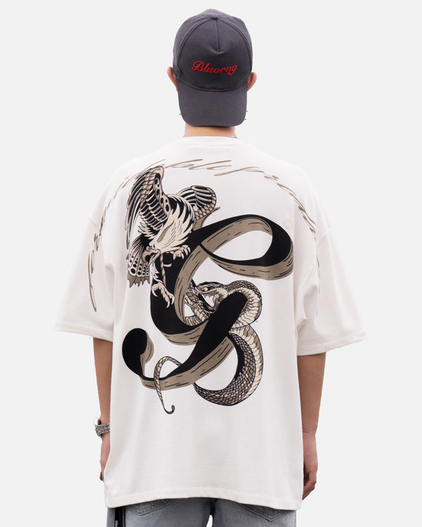 White oversized t-shirt serpent battle graphic