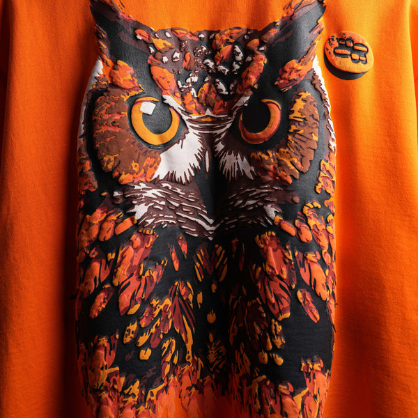 Premium oversized orange tee bold Parliament artwork