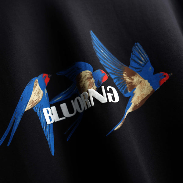 High-density print black t-shirt featuring bird motif and premium oversized fit