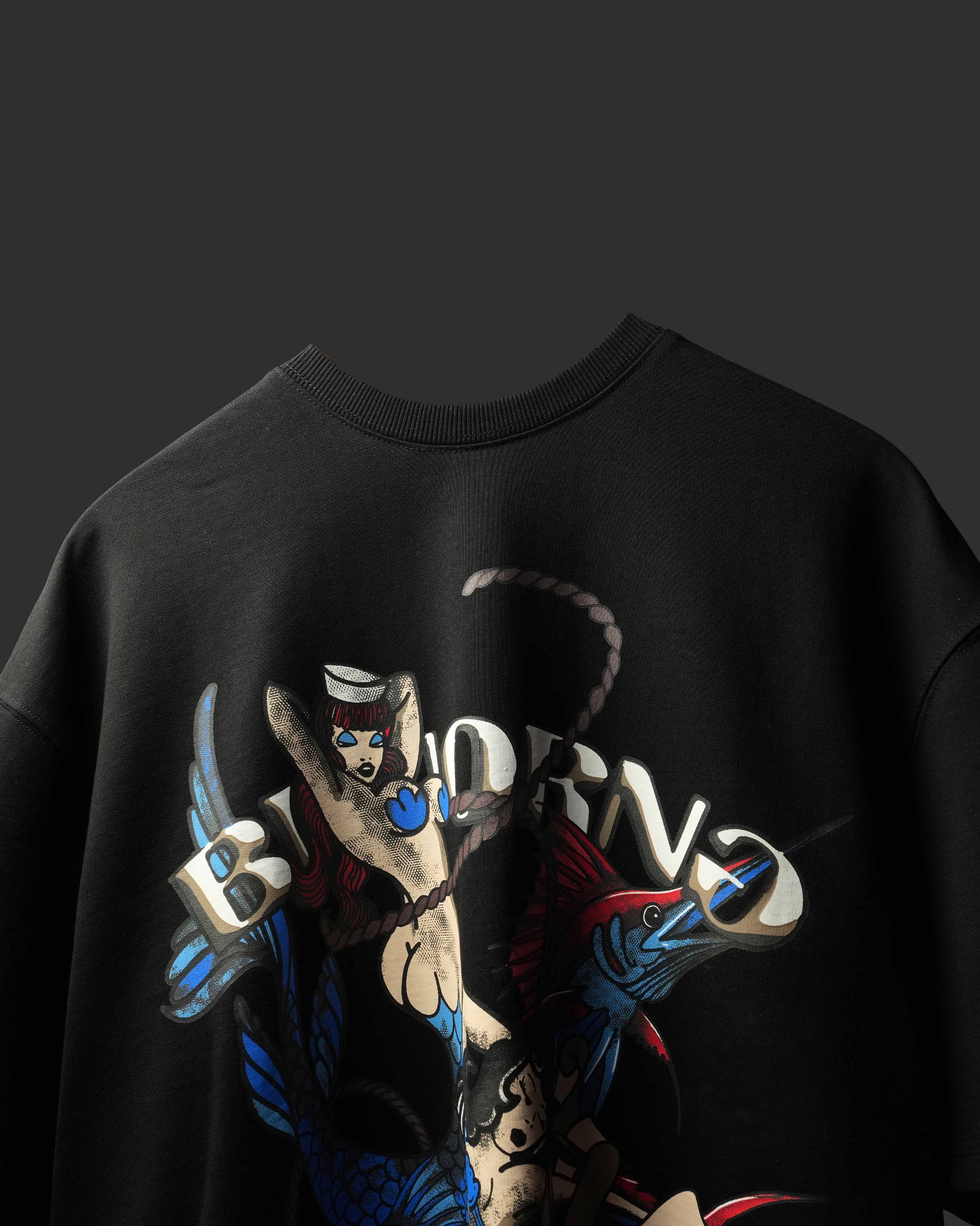 A close-up of a black crewneck T-Shirt