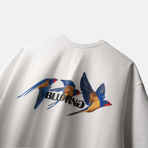 White oversized premium tee featuring bold bird motif